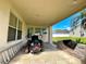 Covered parking area featuring tiled floors and space for outdoor equipment and storage at 2511 Balmoral Dr, Kissimmee, FL 34744
