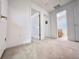 Hallway view with several doors to bedrooms and bathrooms at 2511 Balmoral Dr, Kissimmee, FL 34744