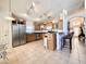 Well-lit kitchen with stainless steel appliances, tile flooring, and a breakfast bar at 2511 Balmoral Dr, Kissimmee, FL 34744