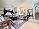 Spacious living room with high ceilings, a ceiling fan, and a decorative floral rug at 2511 Balmoral Dr, Kissimmee, FL 34744