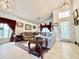 Bright living room featuring tile floors, a chandelier, and a comfortable seating arrangement at 2511 Balmoral Dr, Kissimmee, FL 34744