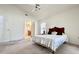 Bright bedroom features vaulted ceiling and a bed with a decorative white lace coverlet at 2511 Balmoral Dr, Kissimmee, FL 34744