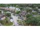 Aerial view of a community with waterway access, lush landscaping, and ample parking at 2662 Emerald Lake Ct, Kissimmee, FL 34744
