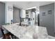 Bright kitchen featuring a marble countertop, ample cabinet space, and stainless steel appliances, perfect for cooking at 2662 Emerald Lake Ct, Kissimmee, FL 34744