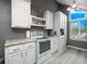 Bright kitchen with white cabinets, modern appliances, and ample counter space, ideal for cooking and entertaining at 2662 Emerald Lake Ct, Kissimmee, FL 34744