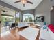 Bright living room featuring hardwood floors and sliding glass doors leading to the lanai at 2662 Emerald Lake Ct, Kissimmee, FL 34744