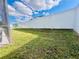 Spacious backyard features lush grass and a tall privacy fence at 2663 Oneida Loop, Kissimmee, FL 34747