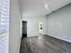 Neutral bedroom with walk-in closet, and sleek gray laminate flooring, offering a modern and clean aesthetic at 2663 Oneida Loop, Kissimmee, FL 34747