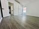 Bedroom featuring vaulted ceiling, closet, and gray wood-look flooring at 2663 Oneida Loop, Kissimmee, FL 34747