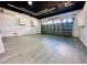 Spacious garage featuring modern ceiling lights, and an automatic door at 2663 Oneida Loop, Kissimmee, FL 34747