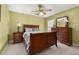 Bedroom featuring a ceiling fan, wooden furniture, and natural lighting at 301 Wingdale Way, Davenport, FL 33897