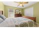Comfortable bedroom featuring natural light, ceiling fan and closet space at 301 Wingdale Way, Davenport, FL 33897