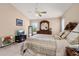 Bedroom with light walls, tile flooring, ceiling fan, and traditional style furniture at 301 Wingdale Way, Davenport, FL 33897