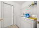 Laundry room featuring washer, dryer, and shelving units at 301 Wingdale Way, Davenport, FL 33897