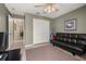 Living room features neutral paint, ceiling fan, and closet at 301 Wingdale Way, Davenport, FL 33897
