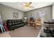 Living room with sofa, ceiling fan, and natural lighting at 301 Wingdale Way, Davenport, FL 33897