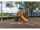 Colorful playground equipment including slides, climbing structures and a covered play area at 301 Wingdale Way, Davenport, FL 33897