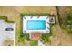 Overhead view of the community pool featuring sundeck, landscaping, and the nearby clubhouse for resident enjoyment at 301 Wingdale Way, Davenport, FL 33897