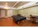 A game room featuring a pool table, a separate table with chairs, and neutral-toned walls at 3344 Corona Village Way # 207, Orlando, FL 32835
