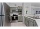 Well-equipped kitchen featuring modern appliances and a functional layout at 3344 Corona Village Way # 207, Orlando, FL 32835