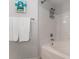 Bright bathroom featuring a tub and a tiled shower at 3344 Corona Village Way # 207, Orlando, FL 32835