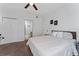 Cozy bedroom featuring a ceiling fan, a double door closet and an ensuite bathroom at 3344 Corona Village Way # 207, Orlando, FL 32835