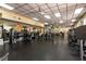 Large community gym with a variety of exercise equipment, mirrors, and ceiling fans at 3344 Corona Village Way # 207, Orlando, FL 32835