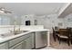 Bright kitchen featuring modern appliances, breakfast bar, and an open floor plan at 3344 Corona Village Way # 207, Orlando, FL 32835