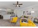 Spacious living room showcasing modern decor, carpet floors, and an open layout at 3344 Corona Village Way # 207, Orlando, FL 32835