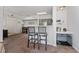 Bright living room with modern gray cabinets and a breakfast bar, perfect for entertaining at 3344 Corona Village Way # 207, Orlando, FL 32835