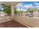 Screened patio with wood-look flooring and community views at 3344 Corona Village Way # 207, Orlando, FL 32835