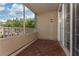 Covered patio with wood-look flooring, ideal for relaxing at 3344 Corona Village Way # 207, Orlando, FL 32835
