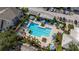 Gorgeous swimming pool featuring lounge chairs, gazebos, and manicured landscaping at 3344 Corona Village Way # 207, Orlando, FL 32835