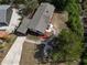 High aerial view of the house featuring an outdoor fire pit and landscaped backyard in a wooded surrounding at 3669 General Marshall Rd, Daytona Beach, FL 32124
