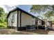 Rear exterior of the home featuring a deck area, perfect for outdoor relaxation and entertainment at 3669 General Marshall Rd, Daytona Beach, FL 32124