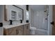 Bathroom with new double vanity, modern fixtures, and a glass enclosed walk-in shower at 3669 General Marshall Rd, Daytona Beach, FL 32124