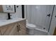 Modern bathroom featuring white marble countertop and walk-in shower with beautiful gray and white tile at 3669 General Marshall Rd, Daytona Beach, FL 32124