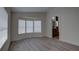 Bright bedroom with hardwood floors and a view to the bathroom, creating a suite-like feel at 3669 General Marshall Rd, Daytona Beach, FL 32124