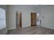 Spacious bedroom with light wood floors, trim, and doors, and multiple access points in a modern home at 3669 General Marshall Rd, Daytona Beach, FL 32124