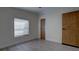 Comfortable bedroom with natural light, modern floors, and a simple aesthetic for a serene space at 3669 General Marshall Rd, Daytona Beach, FL 32124