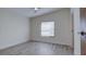 Bright, airy bedroom with ceiling fan, neutral walls, and hardwood floors, offering a relaxing retreat at 3669 General Marshall Rd, Daytona Beach, FL 32124