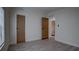 Bright bedroom with modern flooring, neutral walls, and a hallway view, offering a calm atmosphere at 3669 General Marshall Rd, Daytona Beach, FL 32124