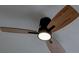 The ceiling fan features wooden blades and provides cool air and overhead lighting at 3669 General Marshall Rd, Daytona Beach, FL 32124