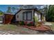 Charming home exterior with lush tropical landscaping, with modern garage at 3669 General Marshall Rd, Daytona Beach, FL 32124