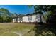 Exterior view of a well-maintained single-story home with landscaping at 3669 General Marshall Rd, Daytona Beach, FL 32124