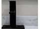 This bathroom features a marble countertop and modern black faucet at 3669 General Marshall Rd, Daytona Beach, FL 32124