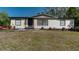Charming single-story home featuring a well-maintained front yard with fresh landscaping and a welcoming entryway at 3669 General Marshall Rd, Daytona Beach, FL 32124
