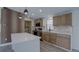 Modern kitchen with stainless steel appliances, quartz countertops, stylish backsplash, and center island at 3669 General Marshall Rd, Daytona Beach, FL 32124