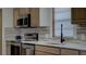 Kitchen featuring modern stainless steel appliances, and quartz countertops at 3669 General Marshall Rd, Daytona Beach, FL 32124