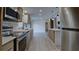 Modern kitchen with stainless steel appliances, quartz countertops, and center island with barstool seating at 3669 General Marshall Rd, Daytona Beach, FL 32124